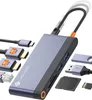 A product shot of a USB-C docking station with various cables and memory cards arranged around it on a white background. Produktbild-Vorschau