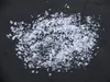 A pile of artificial snow on a black background. Voir les images du produit