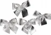 Five silver bows are arranged on a white background. Náhľad obrázku produktu
