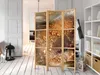 A room interior with a folding screen as the main focus, placed on a wooden floor next to a white shelving unit. Podgląd zdjęcia produktu