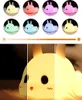 A collage of images showing a cute bunny-shaped night light in various colors and brightness levels. Produktbild-Vorschau