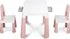 A white and pink children's table with two chairs, set against a white background. Produktbild-Vorschau