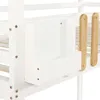 A close-up view of a white bunk bed with wooden accents, showing a storage compartment and part of the slatted base. Produktbild-Vorschau