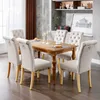 A dining room set with a wooden table and six upholstered chairs. Produktbild-Vorschau
