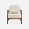 A cream-colored armchair with a bouclé fabric and a wooden frame, presented against a white background. Produktbild-Vorschau