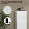 A white shoe cabinet with three flip-down doors is shown, with inset images demonstrating its anti-tip safety features. A hat and a decorative plant are on top of the cabinet. Produktbild-Vorschau