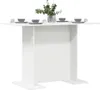 A white dining table set with four place settings and a vase of greenery. Anteprima dell’immagine prodotto