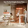A man and a woman are using standing desks in a modern office setting. Produktbild-Vorschau