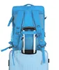 The back of a blue backpack is shown attached to the handle of a light blue suitcase. Náhľad obrázku produktu