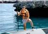 A man on a paddleboard in the water. Náhled obrázku produktu