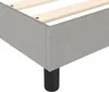 Close-up view of a bed frame corner with visible wooden slats and a black leg. Podgląd zdjęcia produktu