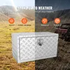 A split image showing a silver aluminum toolbox in a natural outdoor setting on the left and a rainy outdoor setting with a red truck on the right. Text overlays highlight product features. Produktbild-Vorschau