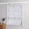 A white Roman blind with a black wavy pattern and beads is shown hanging in a window. Produktbild-Vorschau