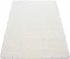 A white shaggy rug is shown from a diagonal angle on a white background. Anteprima dell’immagine prodotto