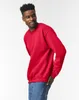 A man wearing a red crewneck sweatshirt and blue jeans, posing against a white background. Produktbild-Vorschau
