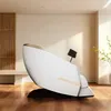 A white massage chair is shown in a room with wooden accents and flooring. Produktbild-Vorschau