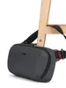 A dark gray Pacsafe sling bag is shown resting on a wooden chair leg. Anteprima dell’immagine prodotto