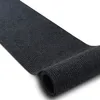 A rolled-up dark gray ribbed mat on a white background. Produktbild-Vorschau
