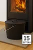 A black metal ash bucket with a lid and handle sits on a gray mat in front of a burning fireplace. Produktbild-Vorschau