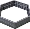 A hexagonal raised garden bed frame made of gray plastic. Voir les images du produit
