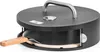A black pizza oven with a silver handle and a wooden pizza peel. Náhľad obrázku produktu