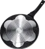 The underside of a black frying pan with a granite-like texture and a silver, patterned insert with multiple circular indentations. The pan has a black handle extending to the right. Anteprima dell’immagine prodotto