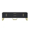A black TV stand with gold accents and legs, presented against a white background. Produktbild-Vorschau