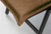 A close-up view of the corner of a brown cushion on a black metal frame. Produktbild-Vorschau
