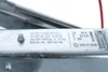 A close-up view of a metal plate with various labels and markings, likely from a trailer or vehicle component. Náhľad obrázku produktu