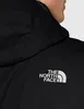 Close-up of a person wearing a black jacket with a white logo. Produktbild-Vorschau