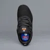 Top-down view of a black shoe against a gray background. Podgląd zdjęcia produktu