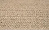 A close-up view of a textured rug. Náhled obrázku produktu
