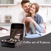 A couple in a kitchen setting, with a coffee set in the foreground. Voir les images du produit