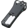 A close-up, angled view of the back of a black handheld digital recorder, showing the battery compartment open with two AA batteries inserted. Anteprima dell’immagine prodotto
