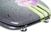 A close-up view of a toilet seat with a decorative design. Produktbild-Vorschau