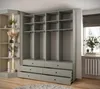 A modern wardrobe with open shelves and drawers, next to a window with a radiator. Produktbild-Vorschau