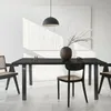 A dining table set with chairs in a modern, minimalist setting. Náhled obrázku produktu