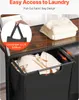 Close-up of a laundry basket with a wooden top, showing a pull-out fabric bag design and a stack of towels on top. Podgląd zdjęcia produktu
