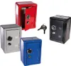 Four small safes in different colors (red, black, gray, blue) are arranged on a white background. A set of keys is also visible. Náhľad obrázku produktu