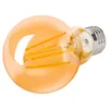 A single amber glass LED light bulb with a silver screw base, lying on its side against a white background. Náhled obrázku produktu