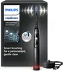 The image shows the packaging of a Philips Sonicare electric toothbrush, along with the toothbrush itself and its charging base. Anteprima dell’immagine prodotto