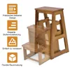 A wooden step stool with informational graphics on the left side. Podgląd zdjęcia produktu
