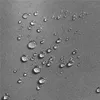 Close-up of water droplets on a textured gray fabric. Produktbild-Vorschau