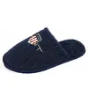A single blue slipper with a logo on a white background. Produktbild-Vorschau