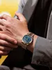 A man wearing a suit and a watch. Podgląd zdjęcia produktu