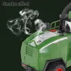 Close-up of a green toy harvester with smoke effects coming from the top. Náhled obrázku produktu