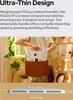 A person holding a flat, white electronic device with a brown holder. Produktbild-Vorschau