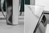 A collage of two close-up shots of a modern dining table, showcasing its design details. Náhled obrázku produktu