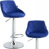 Two views of a blue velvet bar stool with a silver adjustable base.
