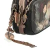 Close-up of a handbag with decorative charms. Anteprima dell’immagine prodotto